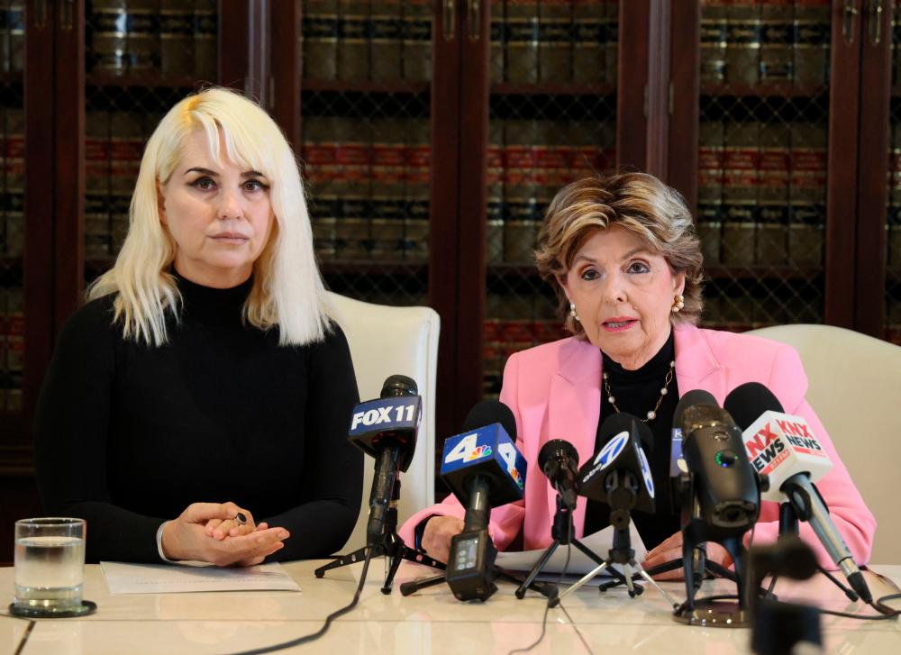 LOS ANGELES, CALIFORNIA - JUNE 01: Gloria Allred (R) and her client, photojournalist Nichol Lechmanik, hold a press conference to announce the filing of a lawsuit against Kanye West (Ye) on June 01, 2023 in Los Angeles, California. AFPPIX