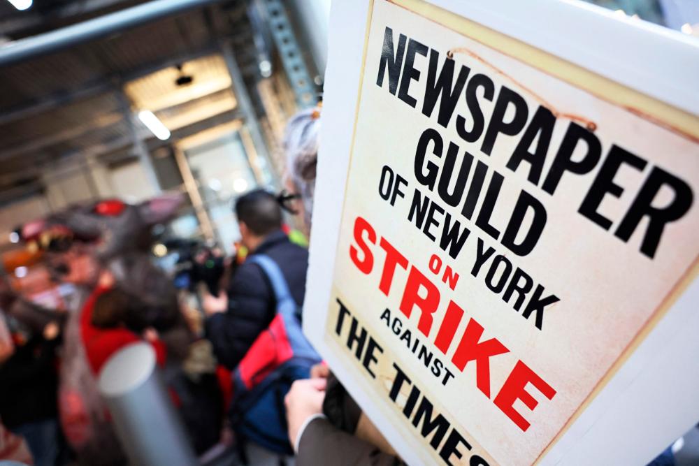 NEW YORK - DECEMBER 08: Members of the New York Times staff hold a rally outside of the New York Times headquarters as they participate in a strike on December 08, 2022 in New York City. AFPPIX