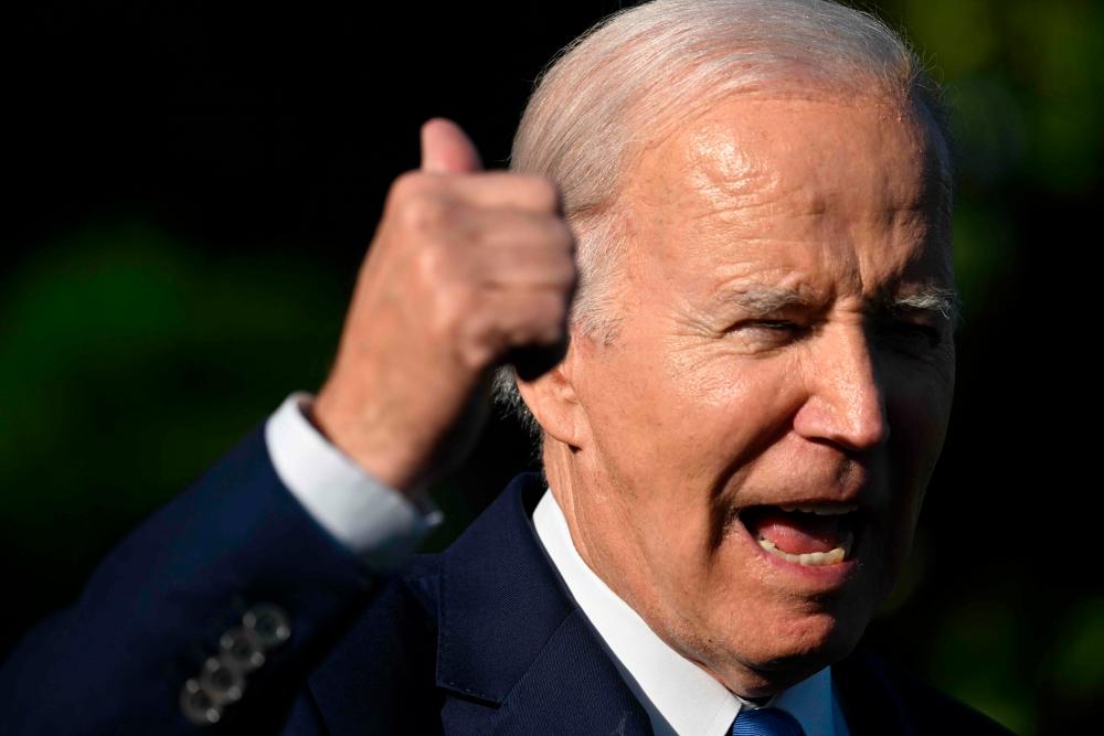 US President Joe Biden speaks with reporters before departing from the South Lawn of the White House on Marine One on May 26, 2023 in Washington, DC. AFPPIX