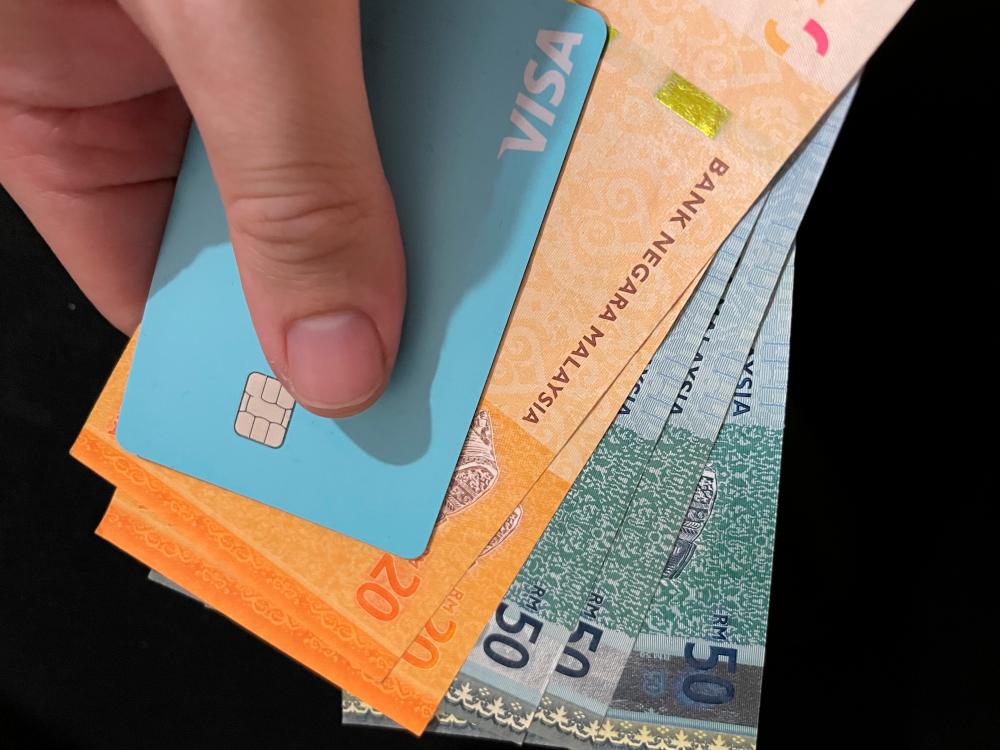 Many Malaysians go into debt because of the easy availability of personal loans and credit cards.