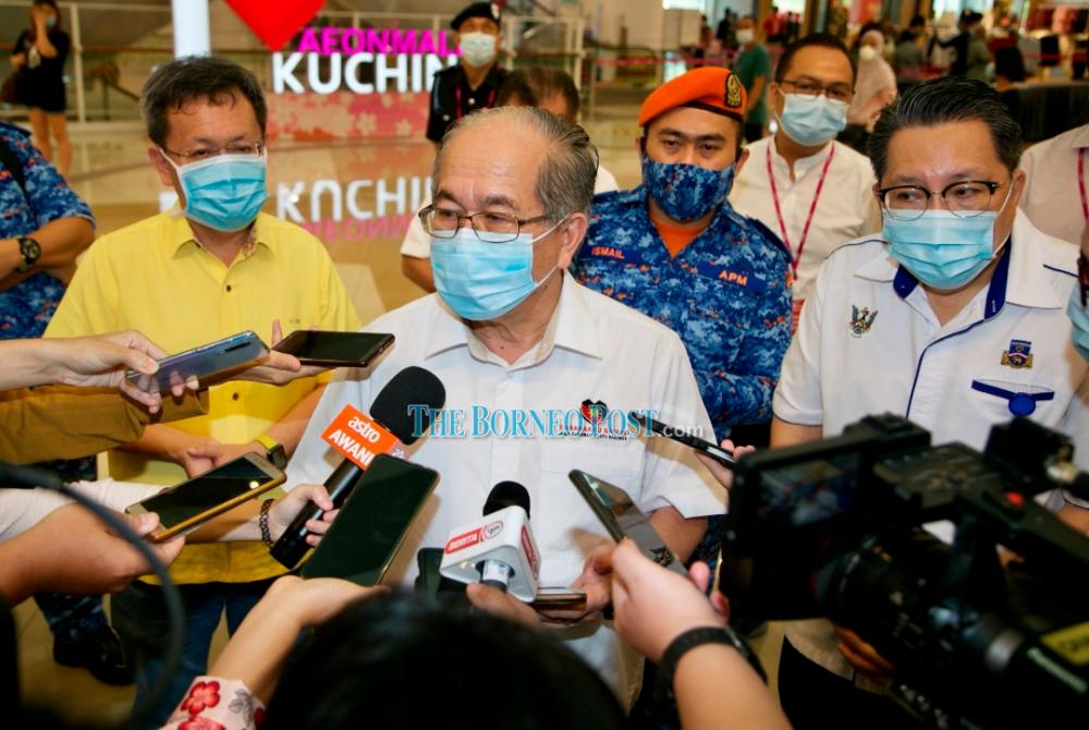Uggah (second left) speaking to reporters today. Also seen is Dr Sim (left) and Wee (right). – Photo by Muhammad Rais Sanusi