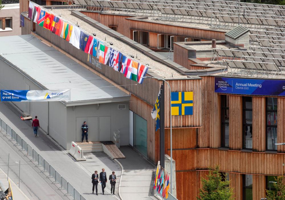 People walk past the congress center, the venue of the World Economic Forum 2022 (WEF) in the Alpine resort of Davos, Switzerland May 22, 2022. REUTERSpix